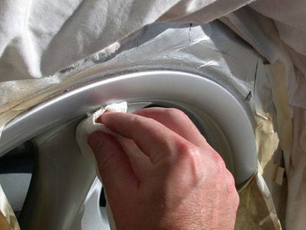 Carefully remove the silver wheel paint overspray